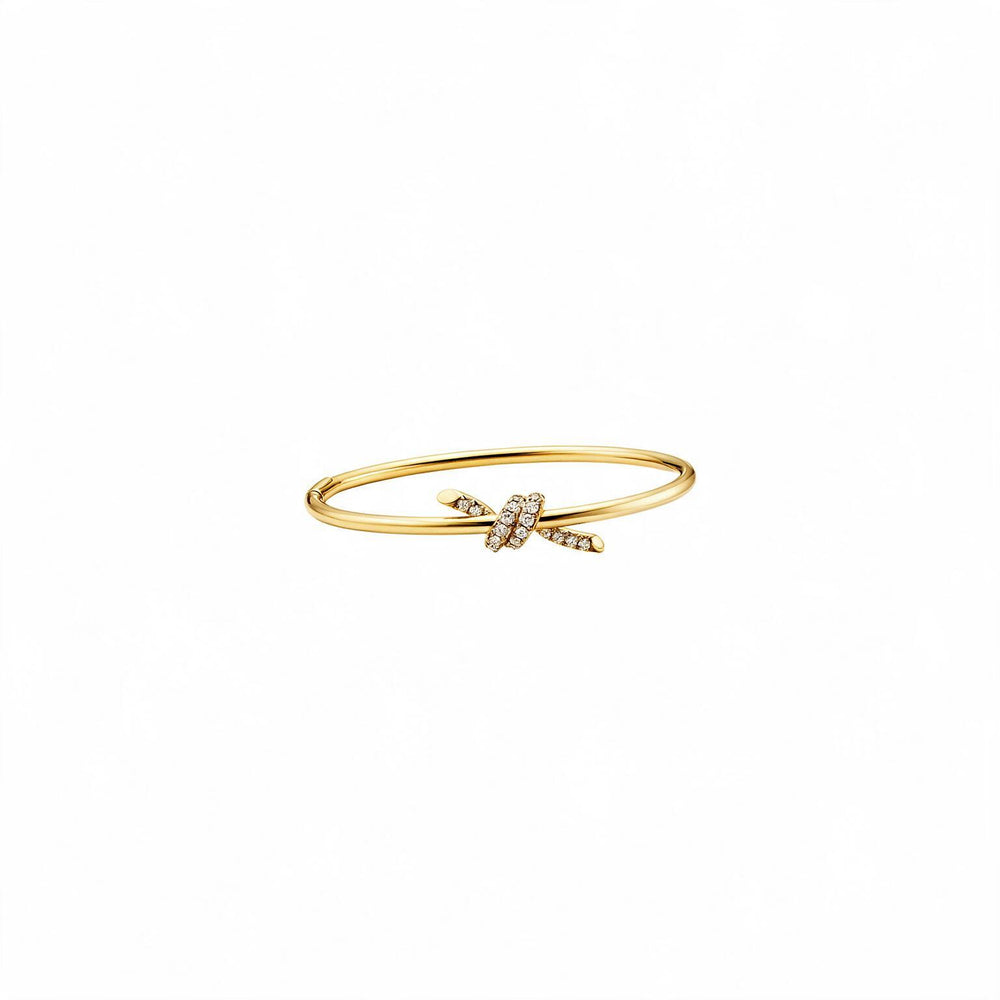 PULSERA T KNOT DELGADA GOLD ZIRCONIAS